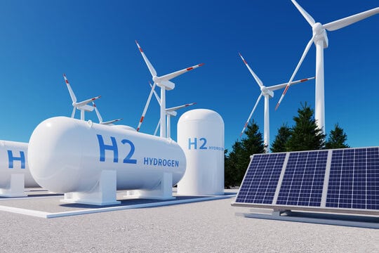Picture showing windmills, solar pannels and hydrogen fuel storage.