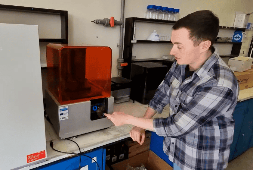 Dr Matthew Ferguson working with the 3D printer